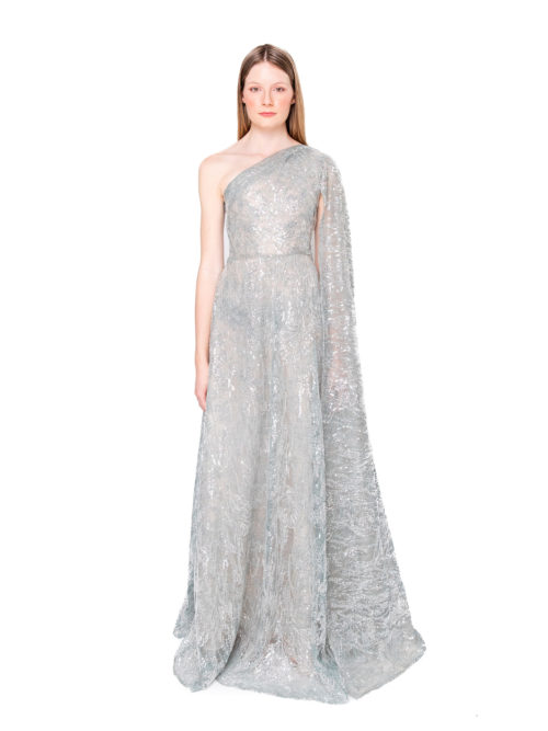 One shoulder embellished cape gown, with long floor length sleeve.