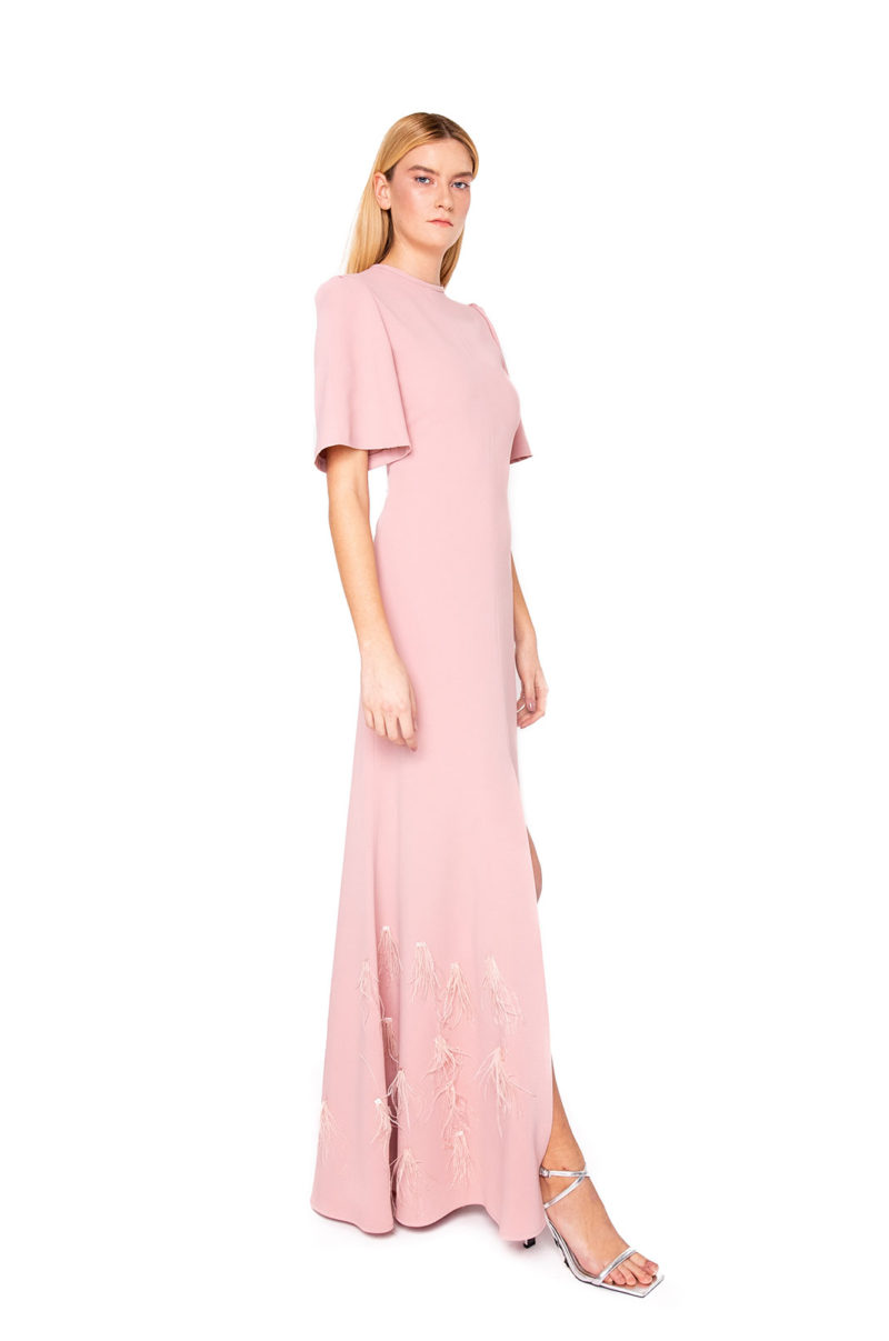 Open slit in the front of this crepe gown